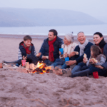 Inheritance Tax - Multigenerational family sitting at beach